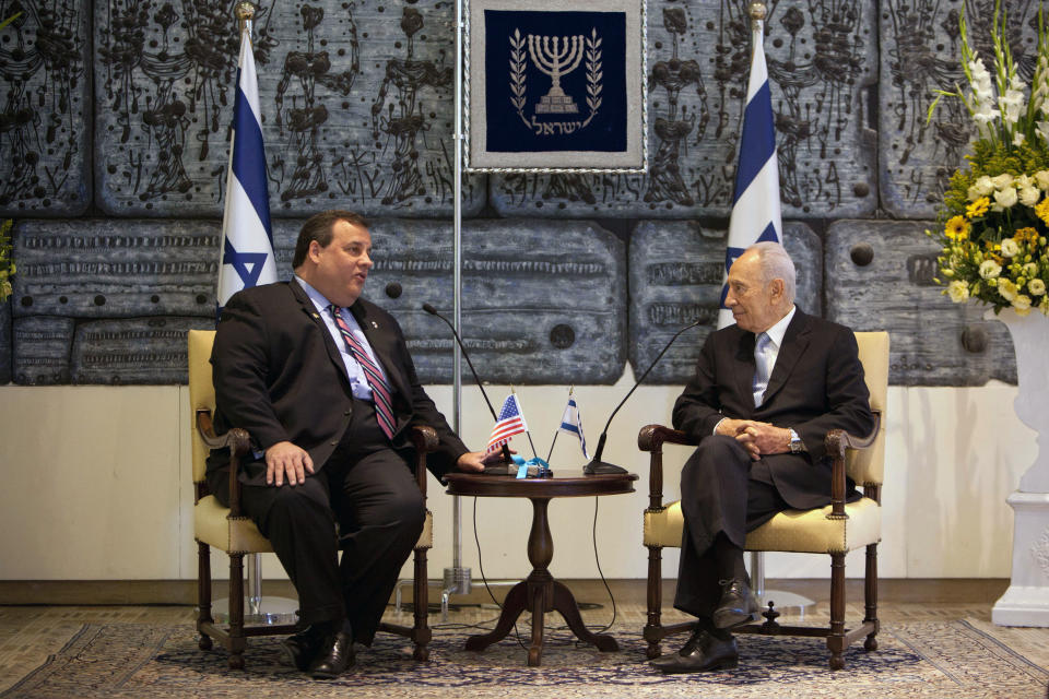 New Jersey Gov. Chris Christie, left, speaks with Israeli President Shimon Peres during their meeting at the President's residence in Jerusalem, Tuesday, April. 3, 2012. Christie kicked off his first official overseas trip Monday meeting Israel's leader in a visit that may boost the rising Republican star's foreign policy credentials ahead of November's presidential election.(AP Photo/Oded Balilty)