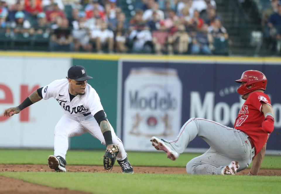 Detroit Tigers shortstop Javier Baez (28) tags out  Los Angeles Angels center fielder  Mike Trout (27) during third-inning action at Comerica Park in Detroit on Friday, Aug. 19, 2022.