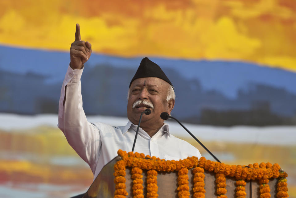 FILE - In this Jan. 21, 2018 file photo, Mohan Bhagwat, chief of the Rashtriya Swayamsevak Sangh, a hardline Hindu group that created the Bharatiya Janata Party as its political arm, addresses a public rally in Gauhati, India. India's ruling party and the main opposition are both supporting a protest to keep females of menstruating age from entering one of the world's largest Hindu pilgrimage sites, in what some political observers say is a bid to shore up votes ahead of next year's general election. Bhagwat has sided with the protesters, saying the “faith of millions of devotees was not taken into account,” during a Hindu festival in New Delhi on Thursday, Oct. 18, referring to a Supreme Court ruling that opened the temple up to women of all ages for the first time in centuries. (AP Photo/Anupam Nath, File)