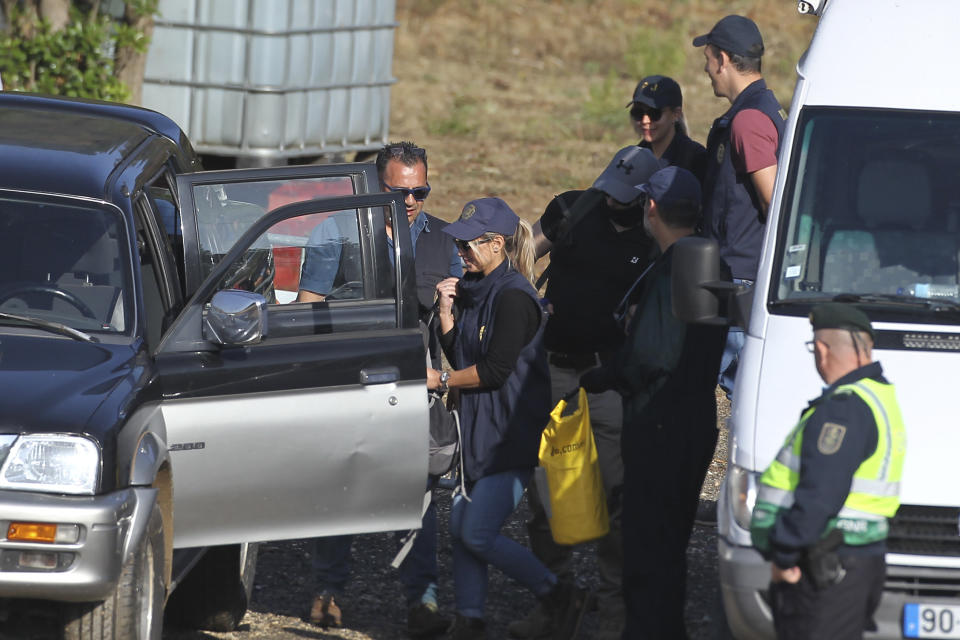 Police search teams prepare to set out from an operation tent near Barragem do Arade, Portugal, Wednesday May 24, 2023. Portuguese police aided by German and British officers have resumed their search for Madeleine McCann, the British child who disappeared in the country's southern Algarve region 16 years ago. Some 30 officers could be seen in the area by the Arade dam, about 50 kilometers (30 miles) from Praia da Luz, where the 3-year-old was last seen alive in 2007. (AP Photo/Joao Matos)