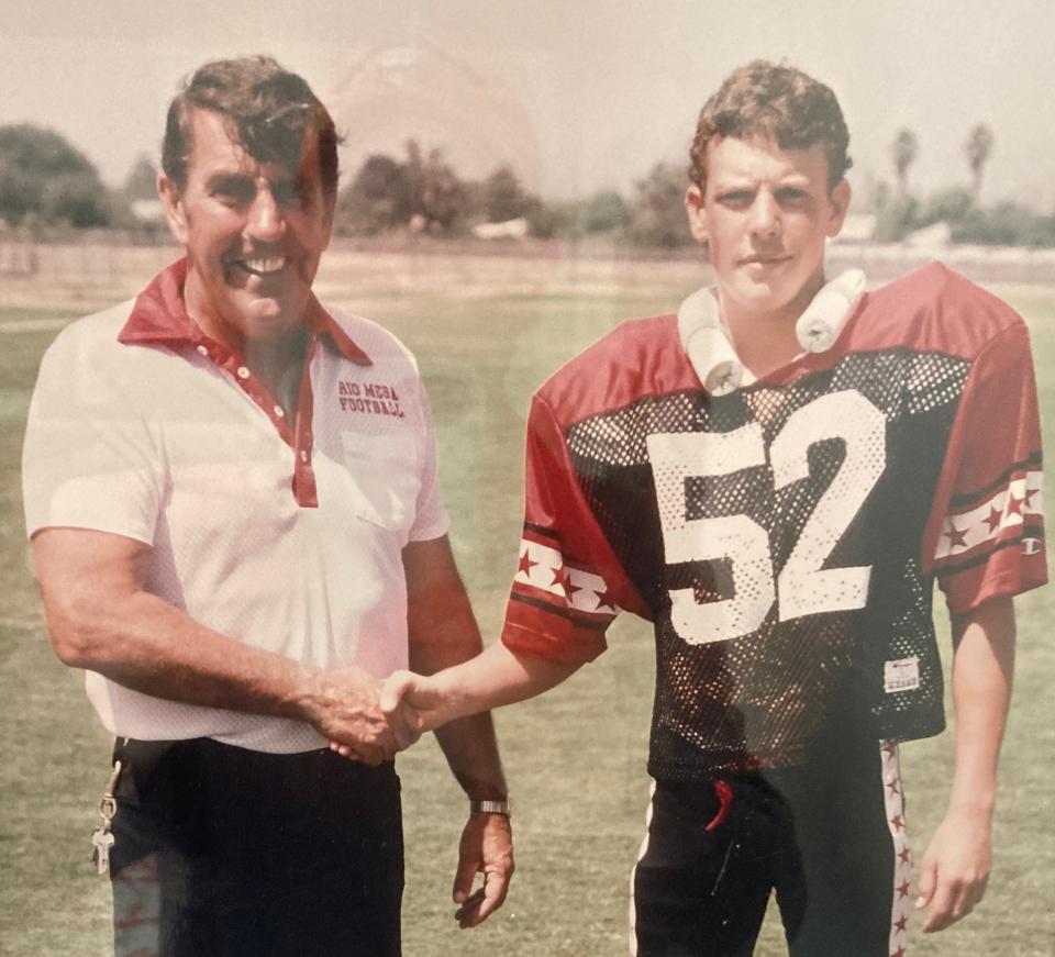 Rio Mesa coach John Reardon shakes his son Barry's hand during the 1984 football season.