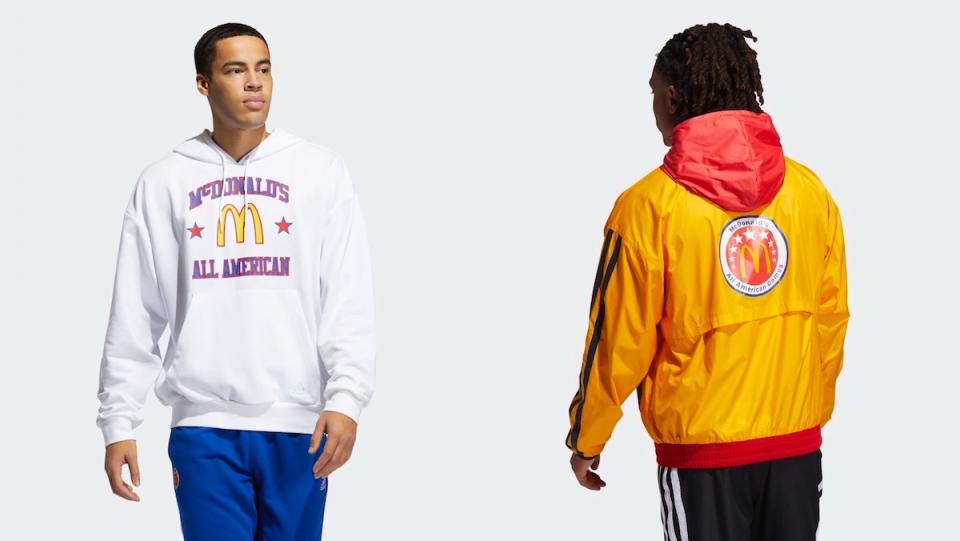 side by side of two men wearing Adidas' McDonald's All American Games apparel, a white hooded sweatshirt and a yellow and red track jacket