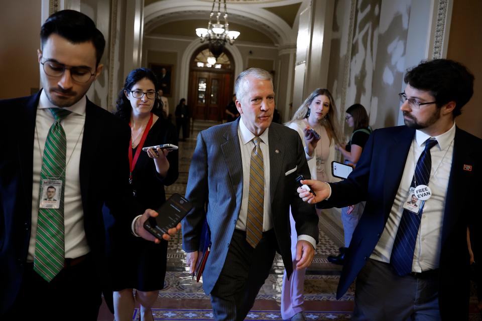 Sen. Dan Sullivan, R-Alaska, talks to reporters as head heads for the offices of Senate Minority Leader Mitch McConnell, R-Ky., before a meeting at the U.S. Capitol on June 01, 2023 in Washington, DC.