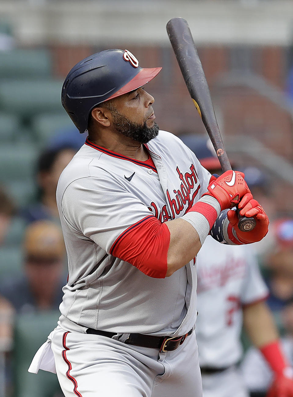 Washington Nationals' Nelson Cruz watches his RBI-single against the Atlanta Braves in the eighth inning of a baseball game Saturday, July 9, 2022, in Atlanta. (AP Photo/Ben Margot)