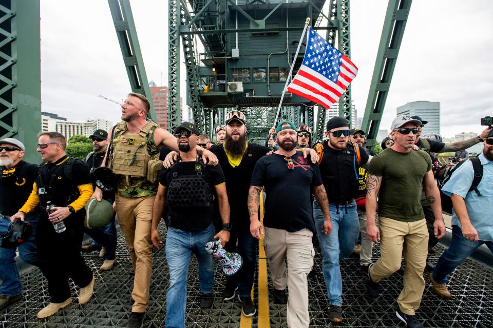 Members of the Proud Boys and other right-wing demonstrators march across the Hawthorne Bridge during an "End Domestic Terrorism" rally in Portland, Oregon, on Aug. 17, 2019.