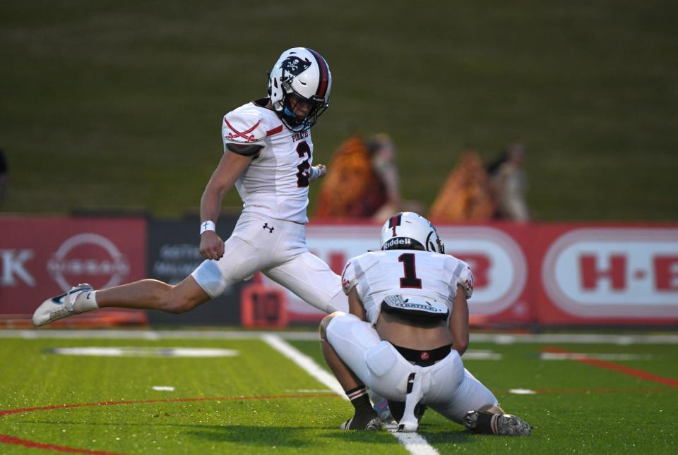 Lubbock-Cooper's Cub Patton kicks for an extra point against Coronado in a District 2-5A Division I football game, Friday, Sept. 29, 2023, at Lowrey Field at PlainsCapital Park.