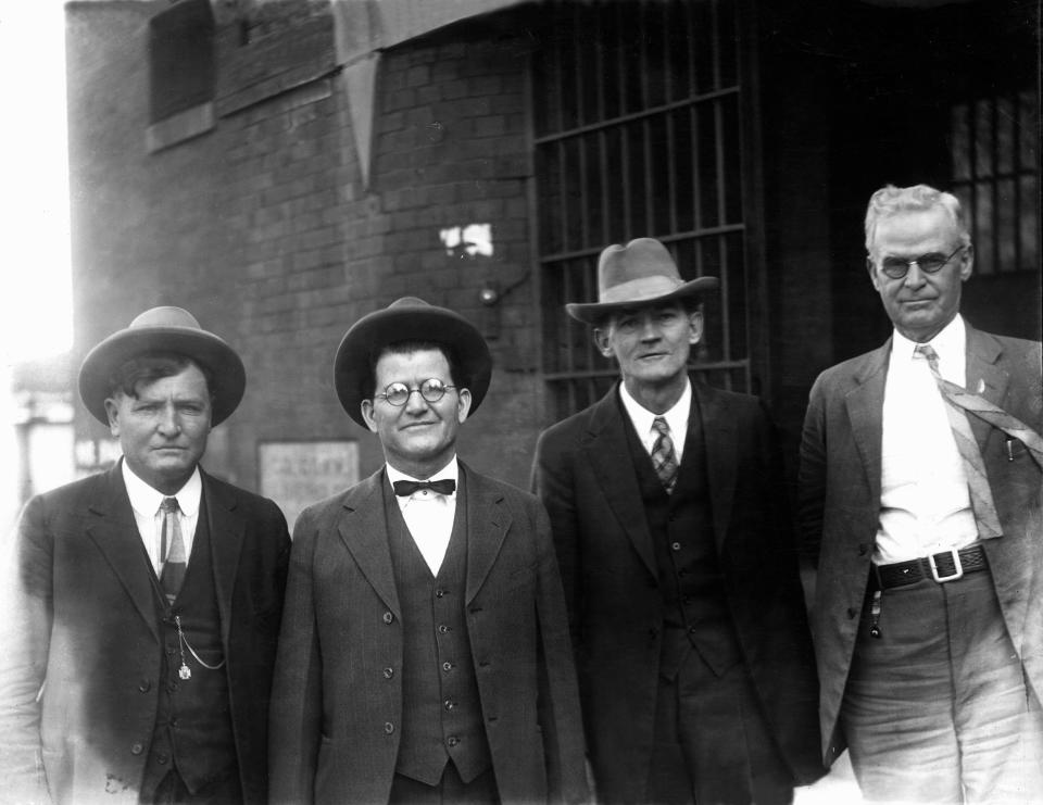 Osage Indian murder perpetrators William K. Hale (second from left) and John Ramsey (second from right) with U.S. Deputy Marshals James A. Stout (left) and J. A. Clouse (right) pose for a photo in 1926. Hale and Ramsey  were tried together in Guthrie in August 1926, when the trial ended in a hung jury, and again in Oklahoma City in October 1926, when both were found guilty and sentenced to life in prison for the January 26, 1923, murder of Osage man Henry Roan near Fairfax, OK.