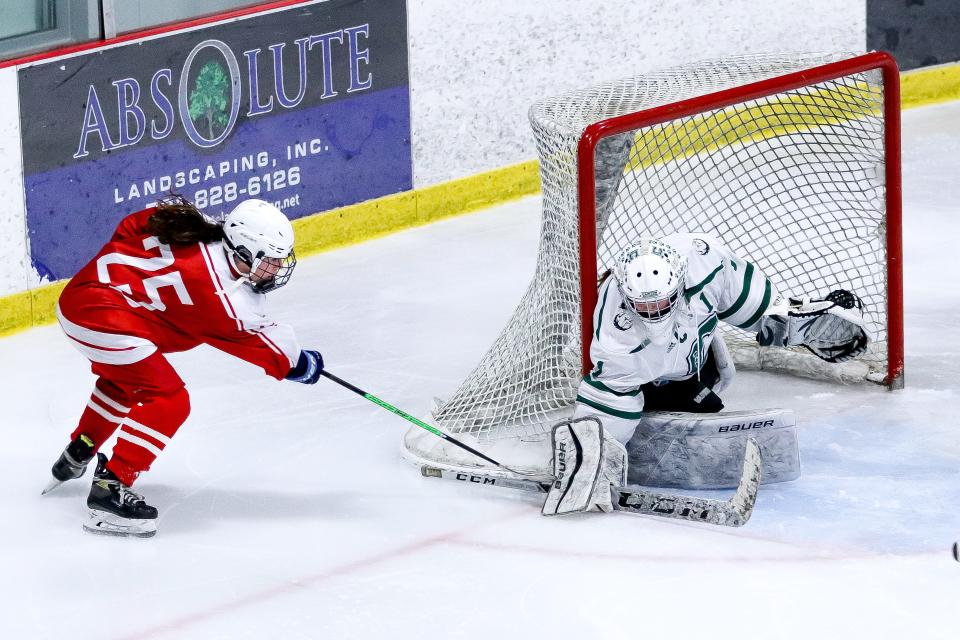 Canton's Carolyn Durand makes a save on Milton's Mary Lovett during the Sweet 16 game in the Div. 2 state tournament at Canton Ice House on Saturday, March 4, 2023.
