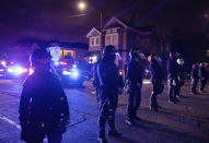 Oakland police officers line the street as demonstrators confront the officers during a protest against police brutality in Oakland, Calif., on Friday, April 16, 2021. (AP Photo/Ethan Swope)