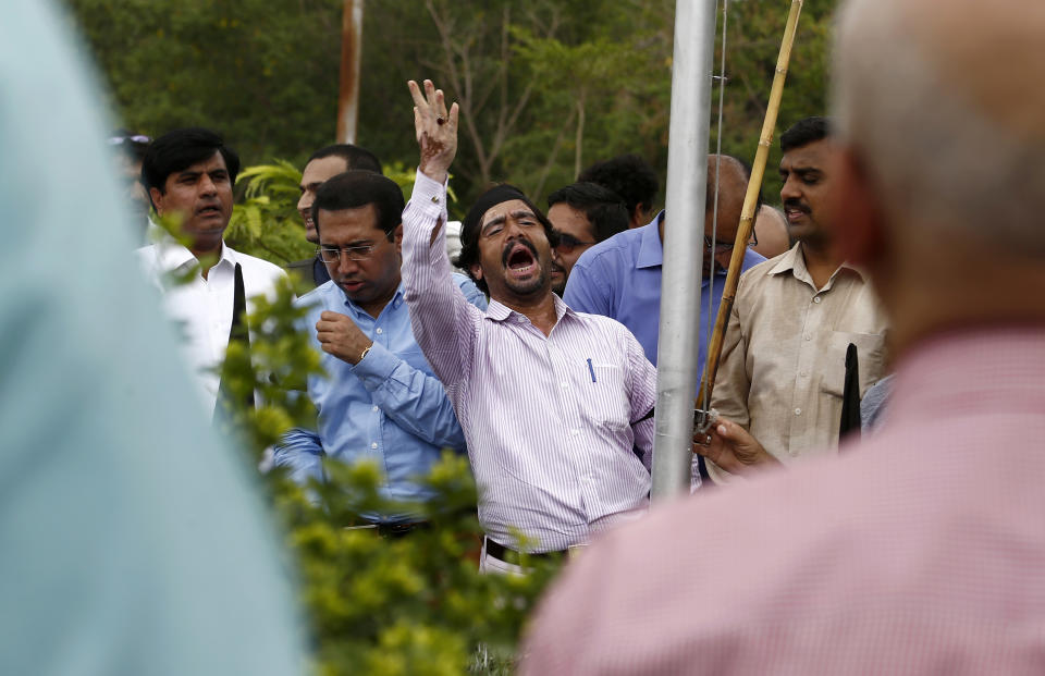 A journalist shouts slogans during a demonstration to denounce rampant censorship, in Islamabad, Pakistan, Tuesday, July 16, 2019. Pakistani journalists are holding nationwide protests to denounce rampant censorship by the country's powerful security services, massive layoffs due to budget cuts and months-long delays in payments of their wages. (AP Photo/Anjum Naveed)