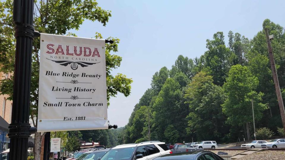 A banner about Saluda is hanging along Main Street.