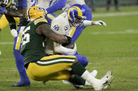 Green Bay Packers' Za'Darius Smith (55) sacks Los Angeles Rams quarterback Jared Goff (16) during the first half of an NFL divisional playoff football game Saturday, Jan. 16, 2021, in Green Bay, Wis. (AP Photo/Morry Gash)