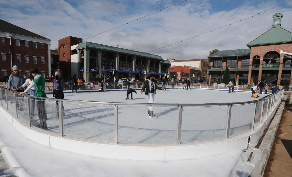 Skaters at the ice rink by the Downtown Pavilion in Cuyahoga Falls. Go to https://www.cityofcf.com/places/ice-skating-rink for information.