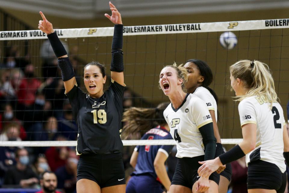 Purdue defensive specialist Jena Otec (19) and Purdue outside hitter Caitlyn Newton (4) react after a point in the fourth set during a second round match of the NCAA Div I Women's Volleyball Championships, Friday, Dec. 3, 2021 in West Lafayette, Ind.