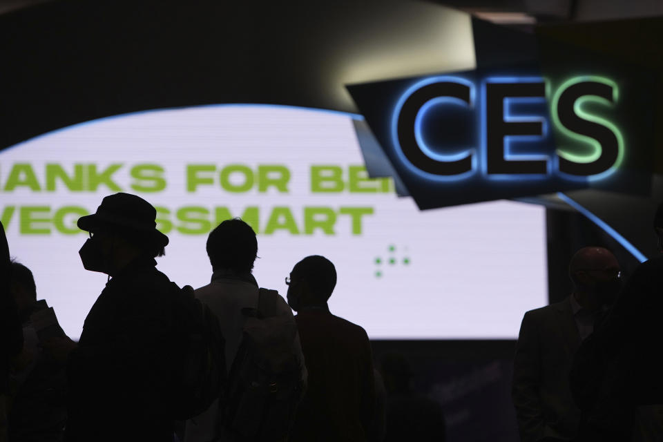 FILE - Attendees wait for the main show floor to open at the CES tech show Wednesday, Jan. 5, 2022, in Las Vegas. The annual tech industry event formerly known as the Consumer Electronics Show is returning to Las Vegas this week, Tuesday, Jan. 3, 2023 with the hope that it looks more like it did before the coronavirus pandemic. The show changed its name to CES several years ago to better reflect the changing industry and the event. (AP Photo/Joe Buglewicz, File)