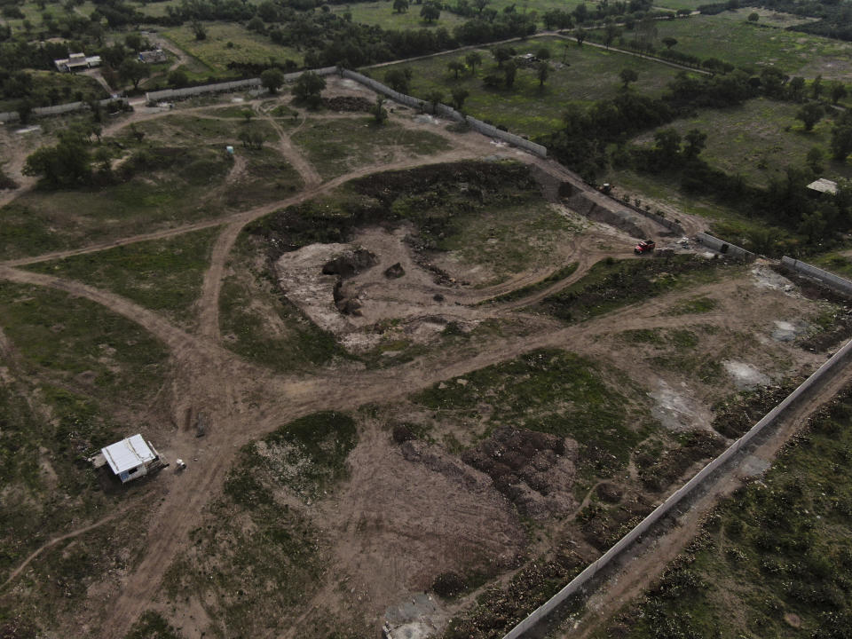 Construction of a private building project is seen on the outskirts of Teotihuacan, just north of Mexico City, Wednesday, May 26, 2021. The Mexican government said Tuesday that the project is destroying part of the outskirts of the pre-Hispanic ruin site and has repeatedly issued stop-work orders since March but the building crews have ignored them. (AP Photo/Fernando Llano)