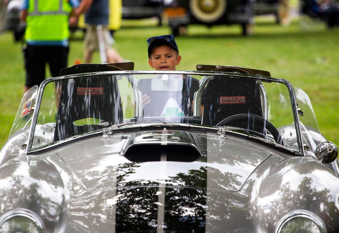 Andrew Monroe, 9, looks at a car during a past Keeneland Concours d’Elegance at Keeneland Race Course.