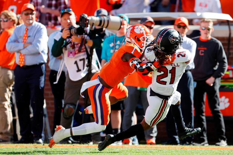 Clemson Tigers safety Andrew Mukuba (1) tackles South Carolina Gamecocks running back Juju McDowell (21) on Saturday, November 26, 2022.