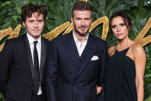 <p>Samir Hussein/WireImage</p> Brooklyn Beckham, David Beckham and Victoria Beckham arrive at The Fashion Awards 2018