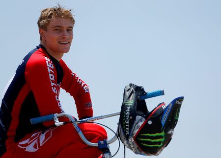 U.S. Olympic athlete Connor Fields sits on his BMX bike as he takes break during a work out at the Olympic Training Center in Chula Vista, California, United States, July 1, 2016. REUTERS/Mike Blake