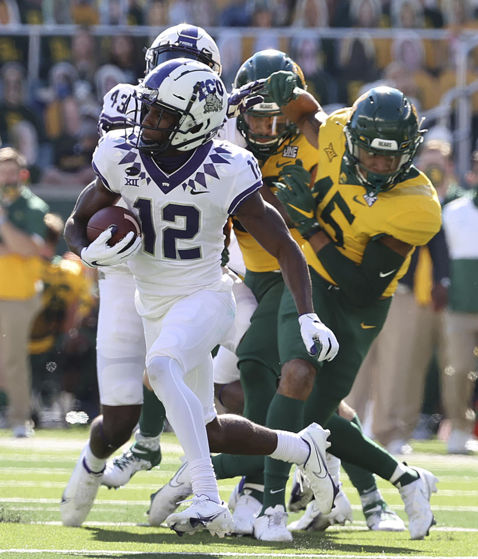 TCU wide receiver Derius Davis (12) runs past the Baylor special teams for a touchdown in the first half of an NCAA college football game in Waco, Texas, Saturday, Oct. 31, 2020. (Jerry Larson/Waco Tribune-Herald via AP)