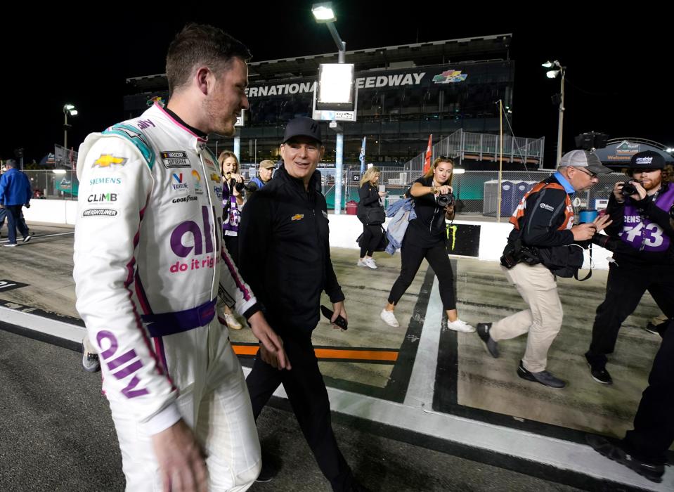 Alex Bowman and Jeff Gordon celebrate winning the pole for the Daytona 500 at Daytona International Speedway, Wednesday, Feb. 15, 2023 