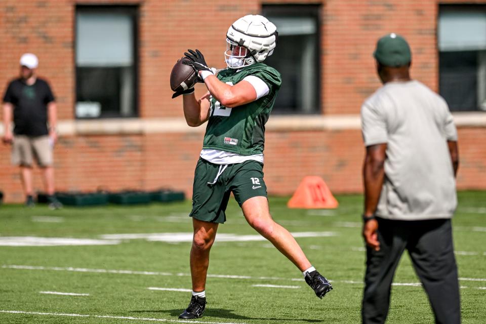 Michigan State's Jack Velling catches a pass during the first day of football camp on Tuesday, July 30, 2024, in East Lansing.