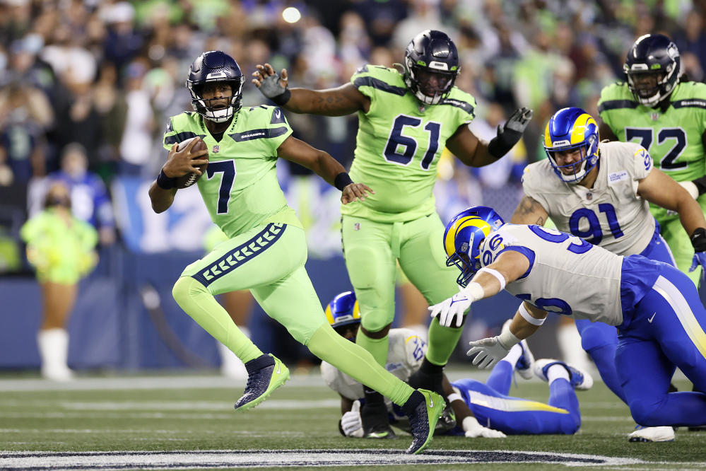 Quarterback (3) Russell Wilson of the Seattle Seahawks puts his hand over  his heart during the National Anthem before playing against the Houston  texans in an NFL football game, Sunday, Dec. 12