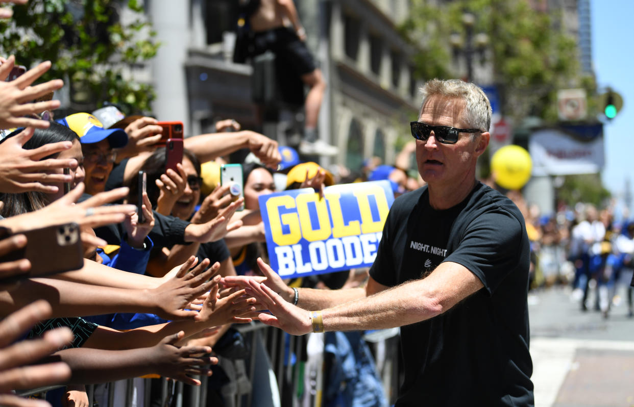 Golden State Warriors head coach Steve Kerr greets fans during the championship parade on June 20, 2022, in San Francisco. (Michael Urakami/Getty Images)