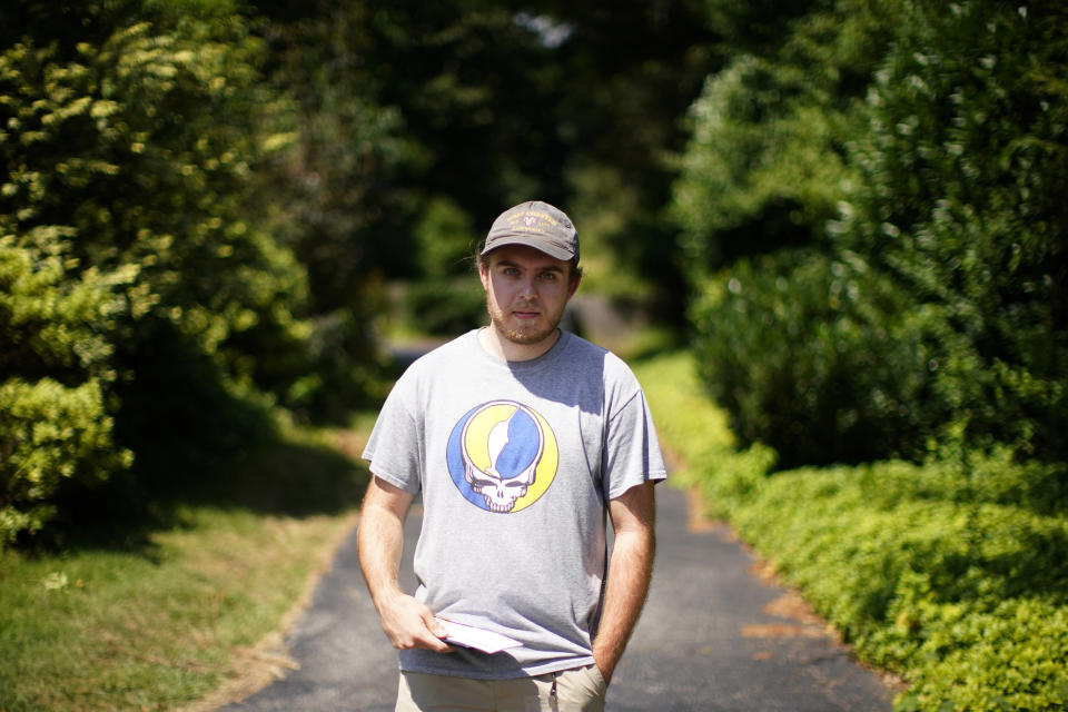 Nick Marcil, 24, of Wayne, Pa., poses for a photograph on Wednesday, Aug. 24, 2022, in Devon, Pa. (AP Photo/Matt Slocum)