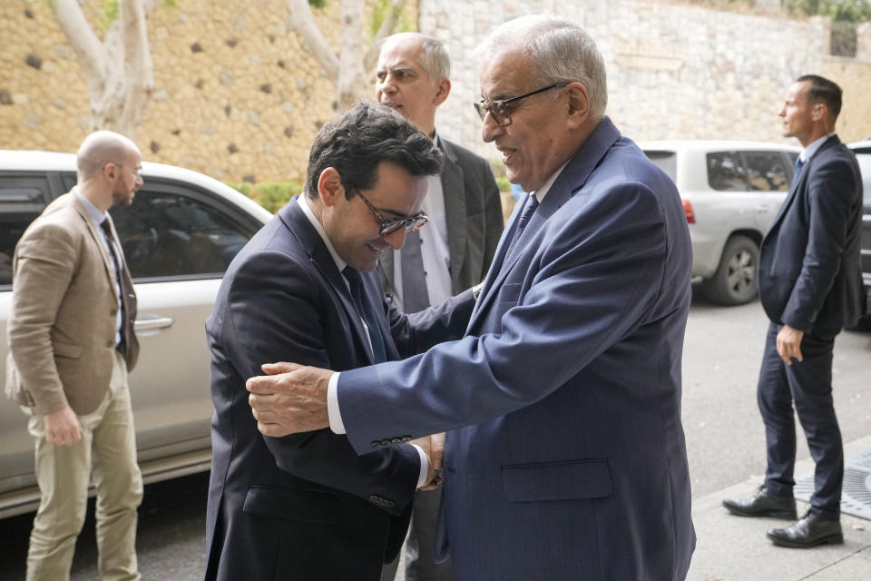 Lebanese Foreign Minister Abdallah Bouhabib, right, welcomes his French counterpart Stephane Sejourne, during their meeting, in Beirut, Lebanon, Sunday, April 28, 2024. (AP Photo/Hassan Ammar)