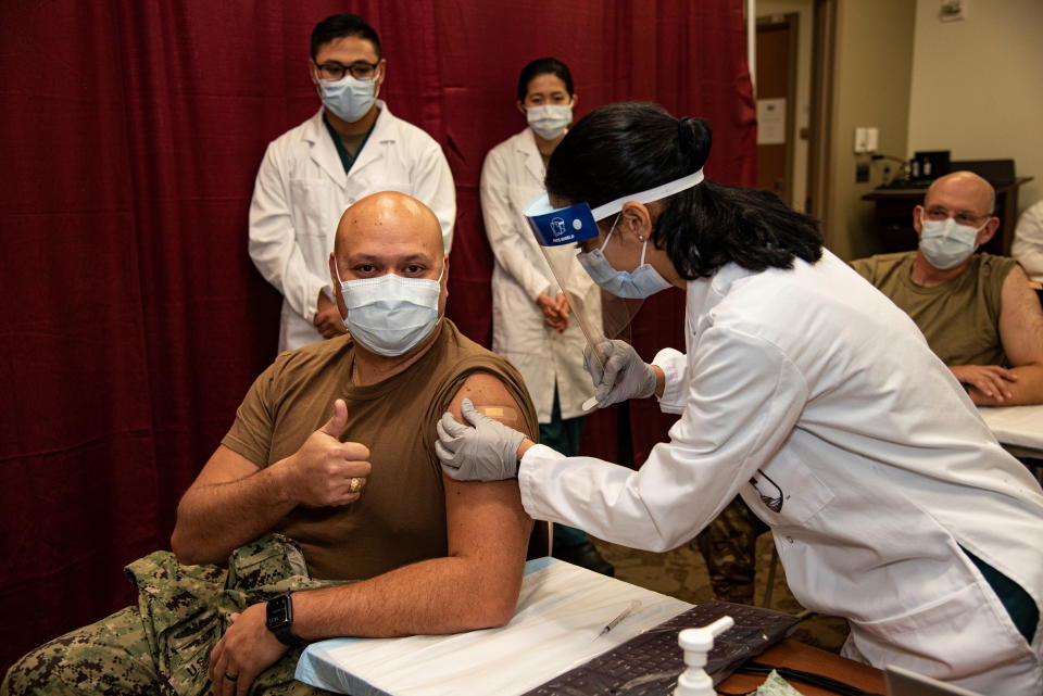 U.S. Navy Command Master Chief Randy F. Swanson receives a Pfizer COVID-19 vaccination at Walter Reed National Military Medical Center at in Bethesda, Maryland, U.S. December 14, 2020. Picture taken December 14, 2020. U.S. Navy/Mass Communication Specialist 2nd Class Kurtis A. Hatcher/Handout via REUTERS    THIS IMAGE HAS BEEN SUPPLIED BY A THIRD PARTY.