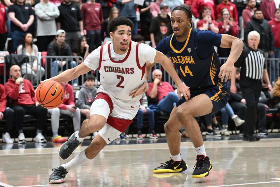 Washington State Cougars guard Myles Rice (2) runs the baseline against California Golden Bears forward Grant Newell (14) in the second half at Friel Court at Beasley Coliseum Feb. 15, 2024, in Pullman, Washington. Washington State Cougars won 84-65.