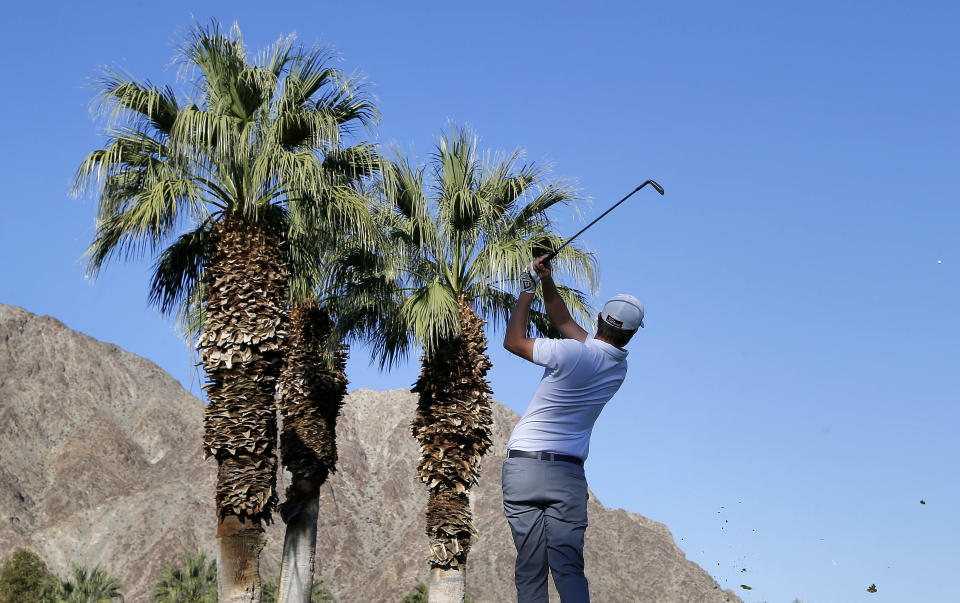 Matt Jones hits from the third tee during the first round of the Humana Challenge PGA golf tournament on the Palmer Private course at PGA West, Friday, Jan. 17, 2014, in La Quinta, Calif. (AP Photo/Matt York)