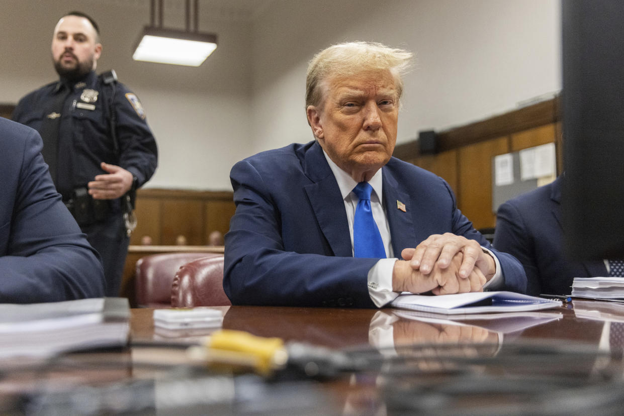Former President Donald Trump awaits the start of jury selection inside Manhattan Criminal Court.