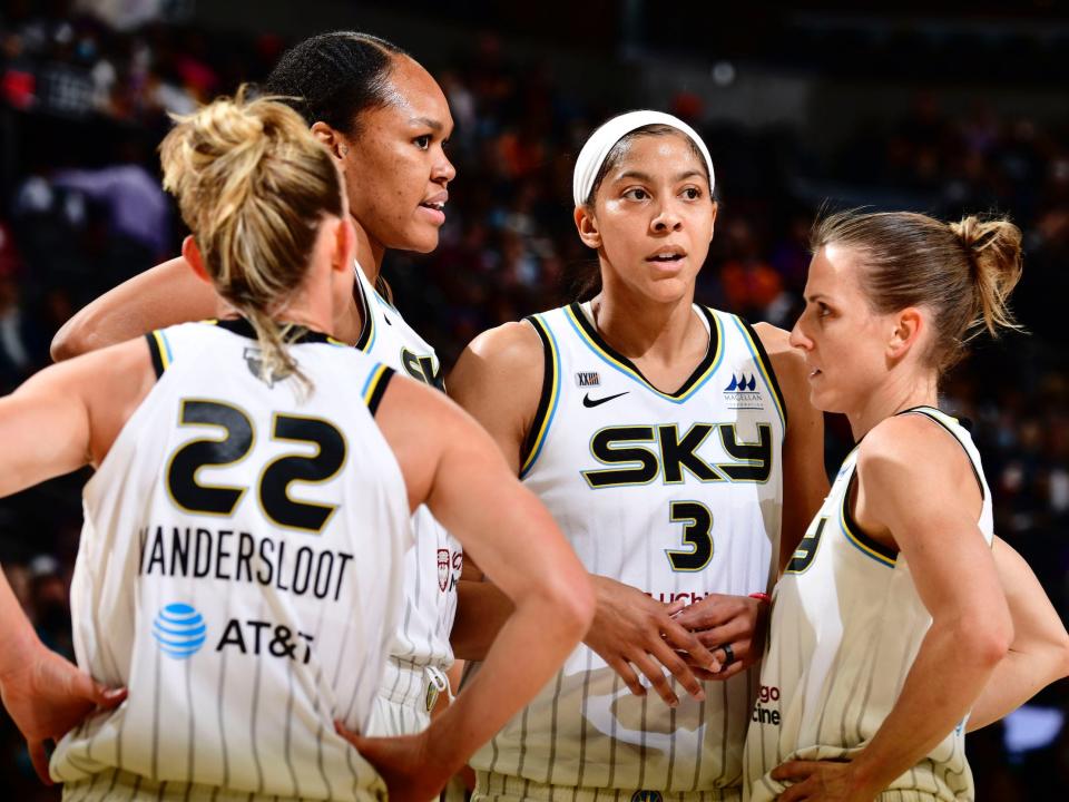 Candace Parker stands with Chicago Sky teammates.