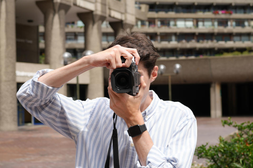 man using fujifilm X-T5 camera shot on Sony a6700