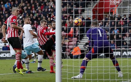 Britain Football Soccer - Southampton v West Ham United - Premier League - St Mary's Stadium - 4/2/17 Southampton's Steven Davis scores an own goal and the third for West Ham Action Images via Reuters / Matthew Childs Livepic