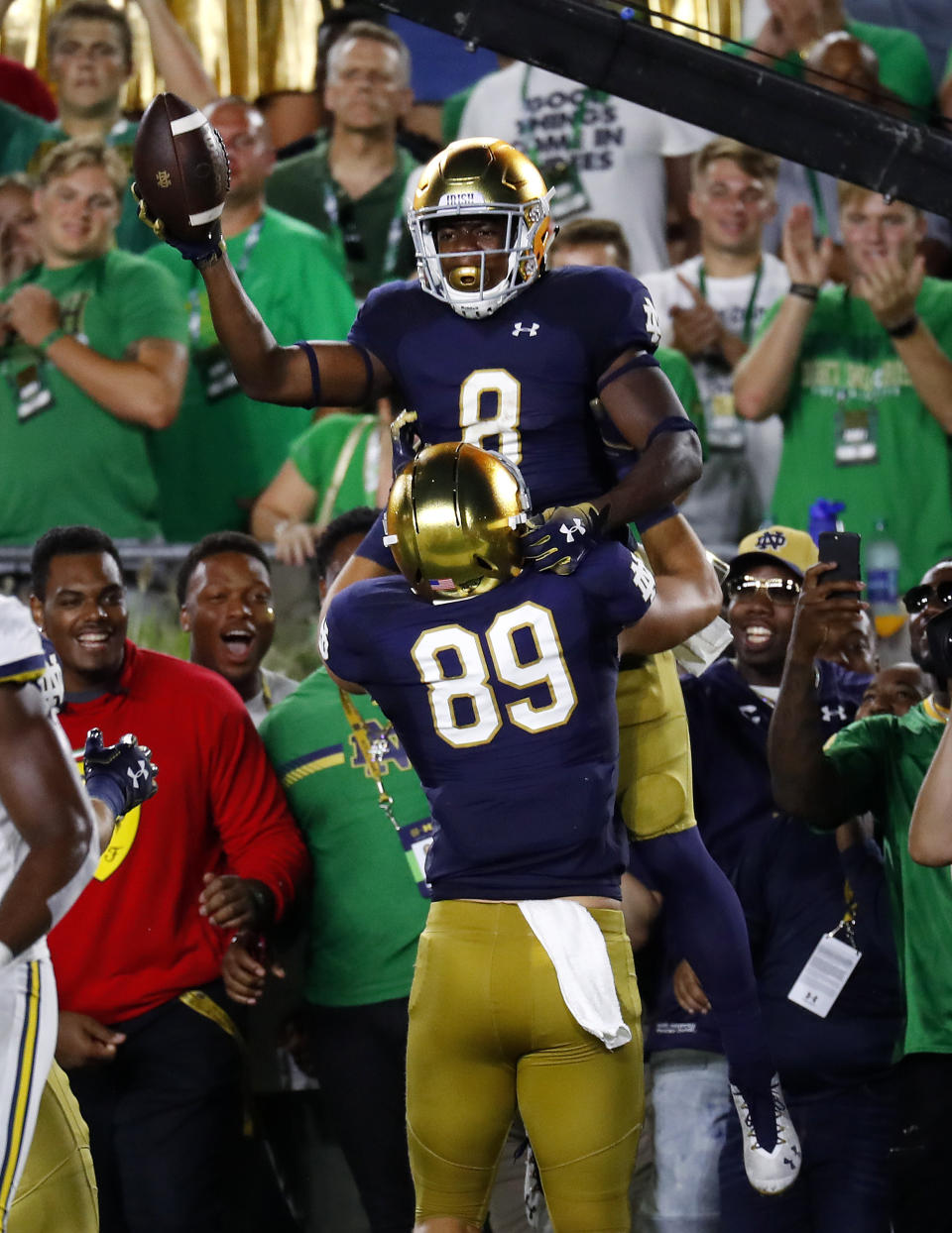 Notre Dame's Jafar Armstrong (8) celebrates his 4-yard touchdown run with Brock Wright (89) in the first half of an NCAA football game against Michigan in South Bend, Ind., Saturday, Sept. 1, 2018. (AP Photo/Paul Sancya)