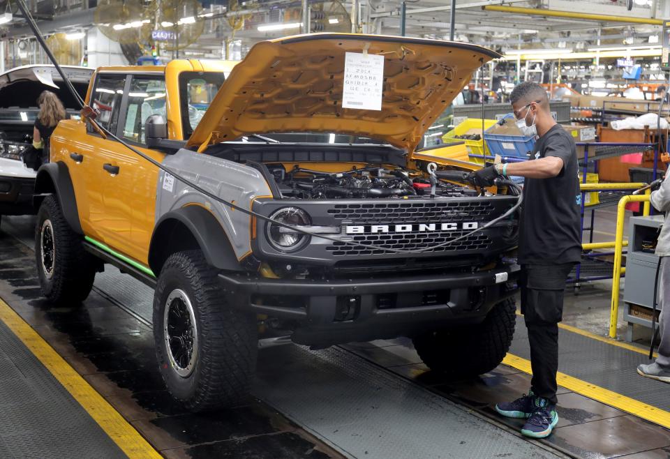 The front grille goes onto a Ford Bronco Monday, June 14, 2021, at the Ford Michigan Assembly Plant in Wayne MI.