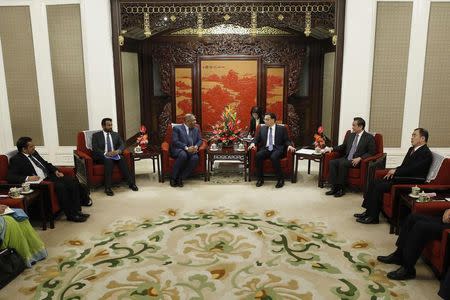 China's Premier Li Keqiang (centre R) and Sri Lanka's Foreign Minister Mangala Samaraweera (centre L) chat during their meeting at the Zhongnanhai Leadership Compound in Beijing, February 27, 2015. REUTERS/Wu Hong/Pool