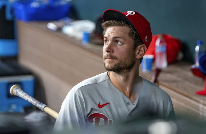 Philadelphia Phillies' Trea Turner walks out of the dugout after losing 11-7 to the Texas Rangers.