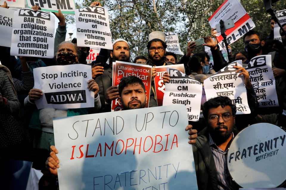 Demonstrators hold placards during a protest against what they say is hate speech against Muslims by Hindu leaders, in New Delhi (Adnan Abidi / Reuters)