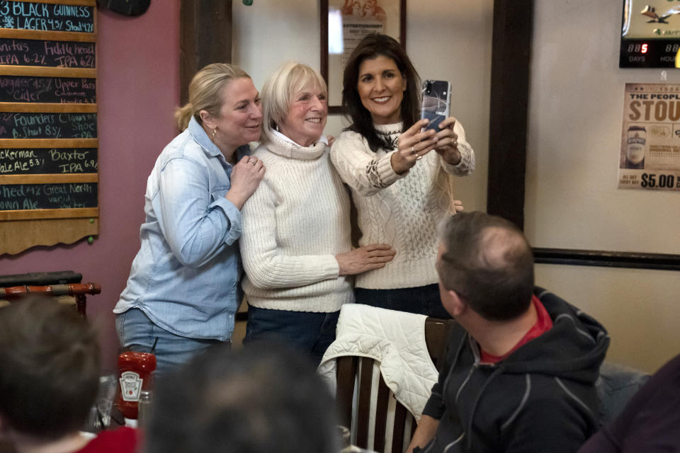 FILE - Republican presidential candidate former UN Ambassador Nikki Haley, right, meets with diners in Epping, N.H., Jan. 21, 2024. Haley has suspended her Republican presidential campaign. The former South Carolina governor ended her White House bid Wednesday, March 6. (AP Photo/Matt Rourke, File)