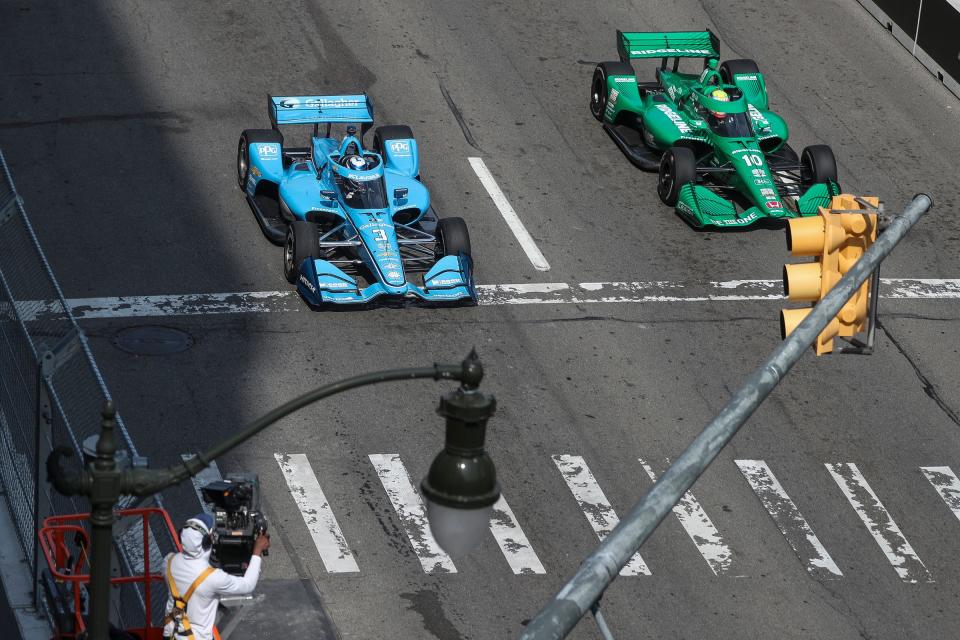 IndyCar drivers Scott McLaughlin, left, is passed by Alex Palou during practice on Jefferson Avenue during the Free Prix Day of Detroit Grand Prix in Detroit on Friday, June 2, 2023.