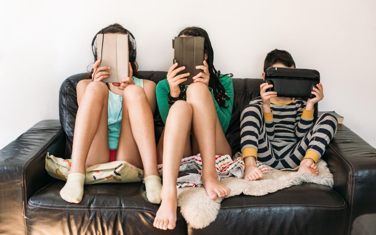 children using personal tablet computers