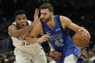 Dallas Mavericks' Maxi Kleber tries to get past Milwaukee Bucks' Giannis Antetokounmpo during the first half of an NBA preseason basketball game Friday, Oct. 15, 2021, in Milwaukee. (AP Photo/Morry Gash)