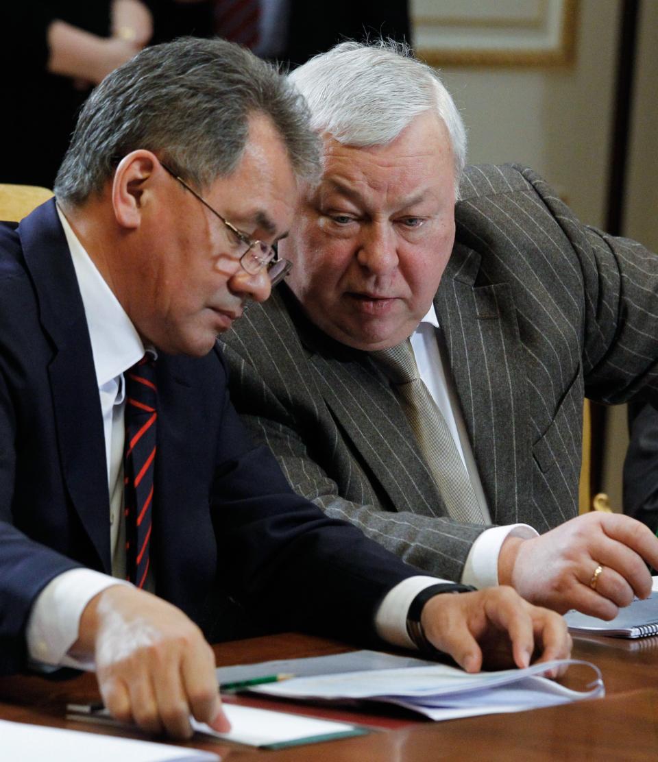 FILE - In this Wednesday, Feb. 2, 2011 file photo Russian then Emergency Situations Minister Sergei Shoigu, left, and Director of the Russian Federal Guard Service Yevgeny Murov attend a meeting on military salaries in the Gorki residence outside Moscow. The U.S. Department of the Treasury on Monday, April 28, 2014, designated seven Russian government officials, including two key members of the Russian leadership’s inner circle, and 17 entities pursuant to Executive Order (E.O.) 13661. E.O. 13661 authorizes sanctions on, among others, officials of the Russian Government and any individual or entity that is owned or controlled by, that has acted for or on behalf of, or that has provided material or other support to, a senior Russian government official. Murov is on the list. (AP Photo/Mikhail Klimentyev, Presidential Press Service, File)