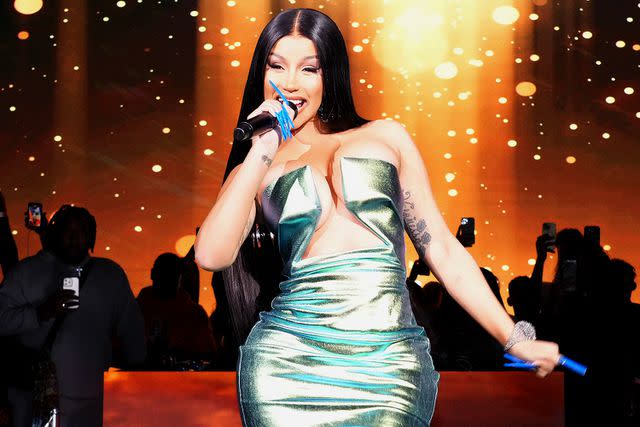 <p>Jeff Kravitz/FilmMagic</p> Cardi B performs in Arizona in February 2023