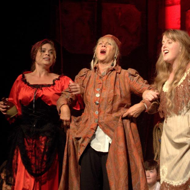 Isle of Wight County Press: Zoe Divers as Nancy, Julie Jones as Fagin, and Carol Simpson as Bet. Oliver! at the Apollo Theatre in Newport.